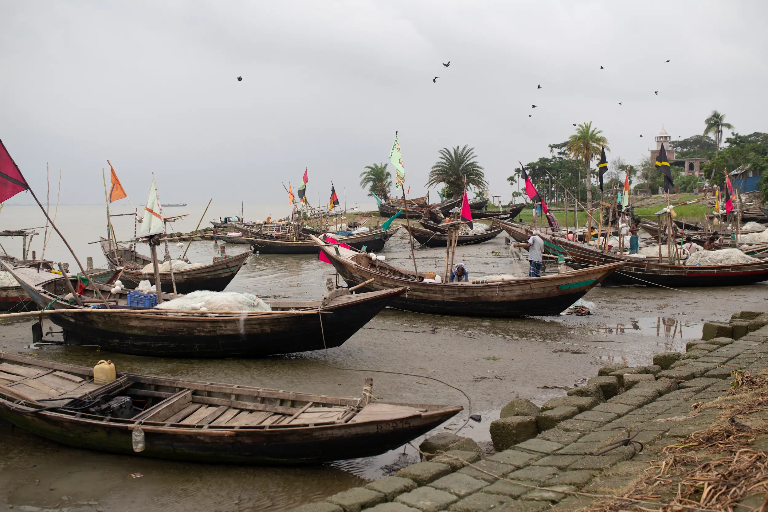 Documentary crew filming floating markets in Barisal Bangladesh