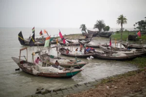 Traditional fishing boats on a riverbank in Bangladesh – perfect location for documentary shoots