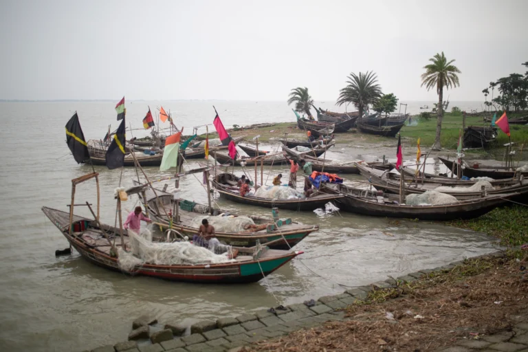 Traditional fishing boats on a riverbank in Bangladesh – perfect location for documentary shoots