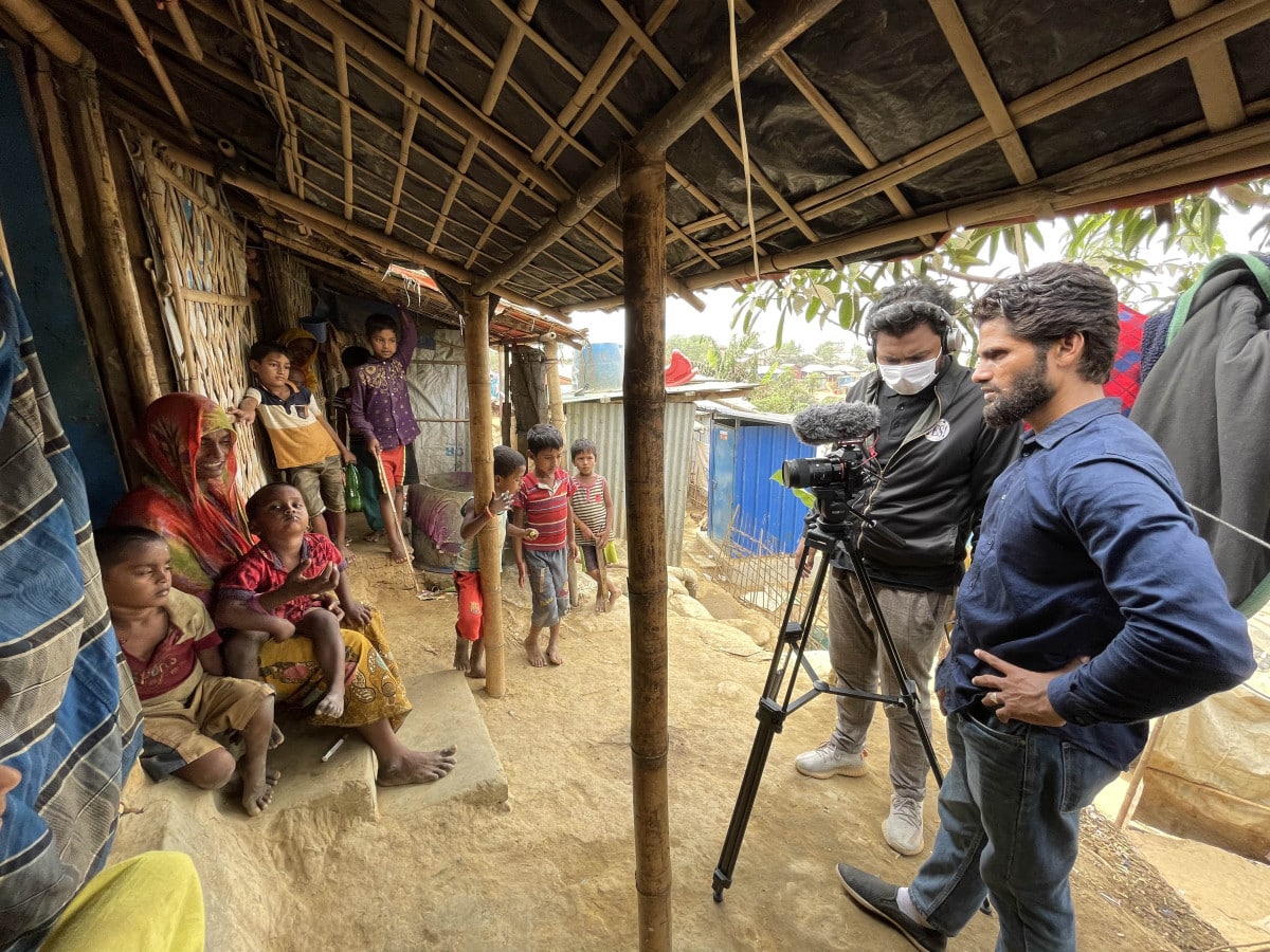 fixer in bangladesh and filmmaker conducting a shoot inside Rohingya camp in Bangladesh