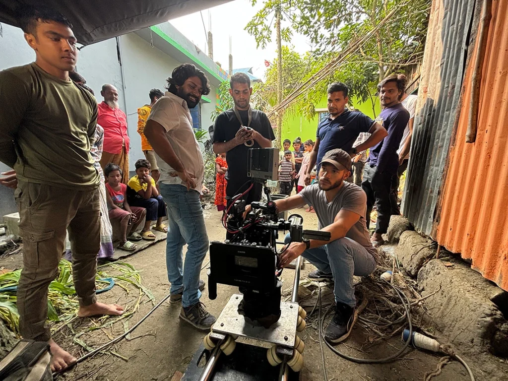 Film crew scouting filming locations in a local village in Bangladesh