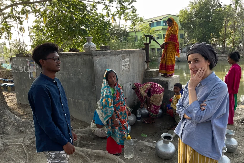 Professional fixer coordinating with local authorities during international media production in Bangladesh