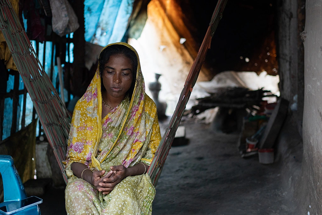 Buli Dasi, 35, a climate widow from Fishermen's Village in Munshiganj Bazar, Shyamnagar. Her husband was killed by a tiger while collecting honey in 2002, leaving her to raise their children alone amid stigma and poverty.